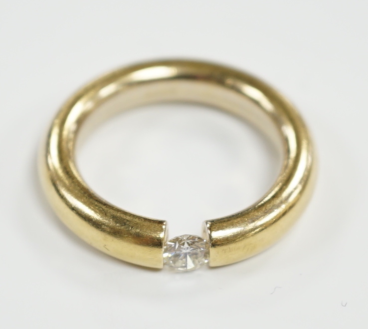 A modern 750 yellow metal and solitaire diamond set ring, size M, gross weight 6.1 grams, the stone measuring 4.1mm in diameter.